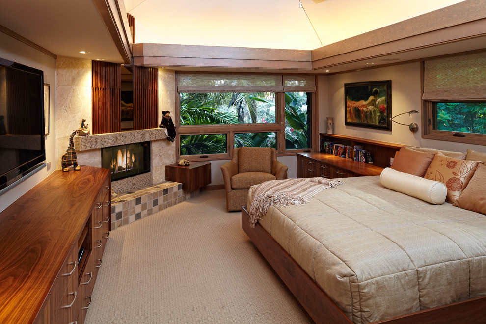Design ideas for a contemporary bedroom in Miami with a corner fireplace.