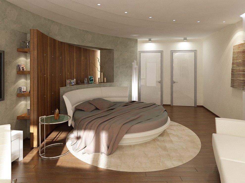 Esempio di una camera da letto minimal con pareti bianche e pavimento in legno massello medio