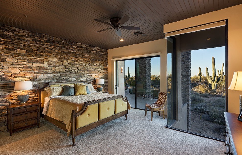 Medium sized rustic master bedroom in Phoenix with beige walls, carpet and no fireplace.
