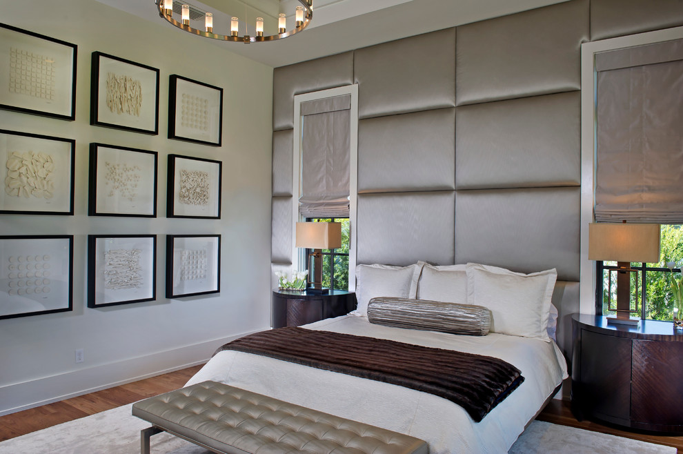 Large trendy master dark wood floor and brown floor bedroom photo in Orlando with beige walls and no fireplace