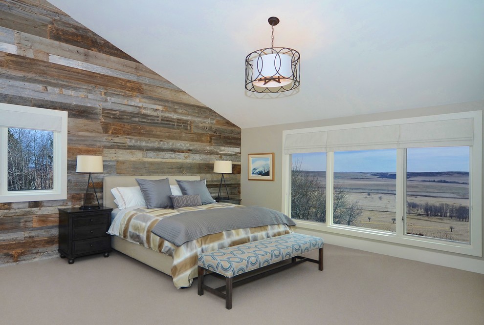 This is an example of a contemporary master bedroom in Calgary with beige walls and carpet.