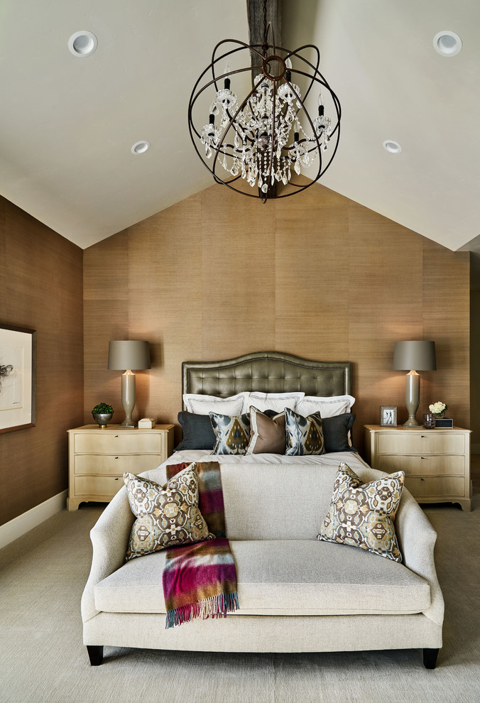 Inspiration for a large country master carpeted and beige floor bedroom remodel in Portland with beige walls, a standard fireplace and a stone fireplace