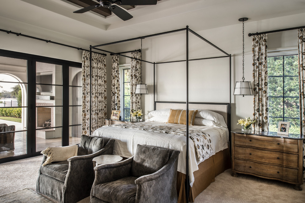 Inspiration for a mediterranean grey and brown bedroom in Orlando with beige walls, carpet and beige floors.