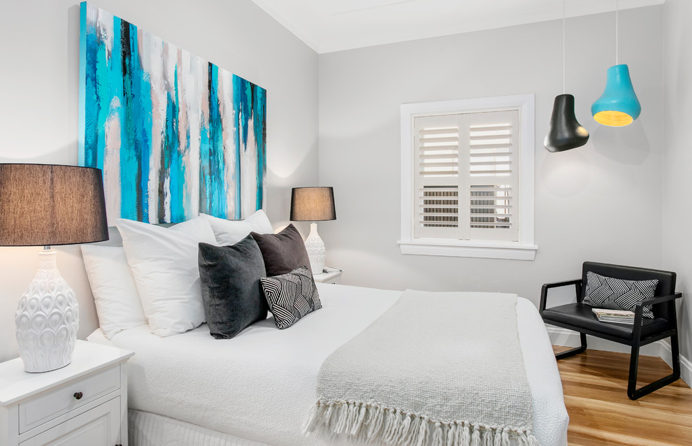 Bedroom - small contemporary guest brown floor and medium tone wood floor bedroom idea in Sydney with gray walls