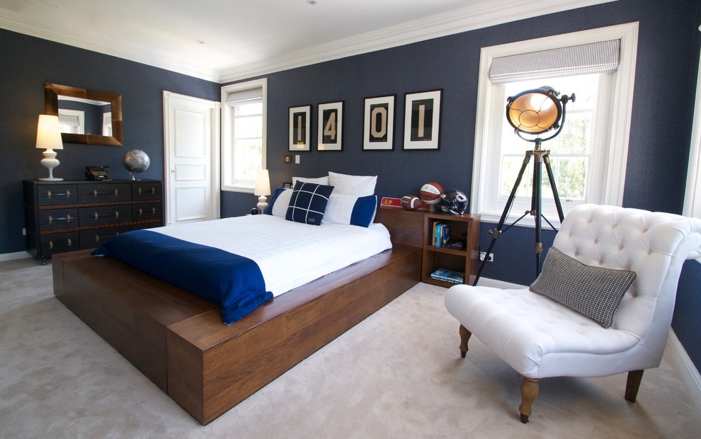 Large trendy carpeted bedroom photo in Sydney with blue walls