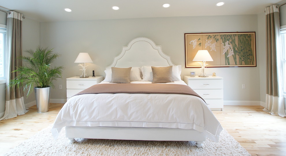 Design ideas for a contemporary bedroom in Boston with grey walls and light hardwood flooring.