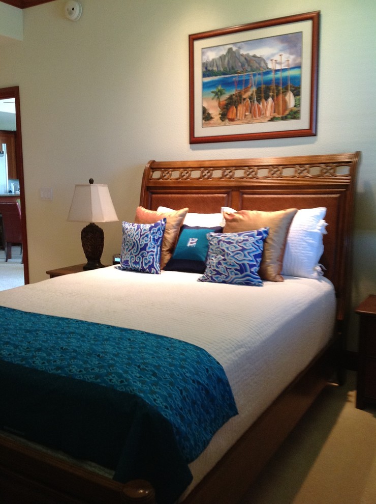Example of a mid-sized island style carpeted bedroom design in Hawaii with beige walls and no fireplace