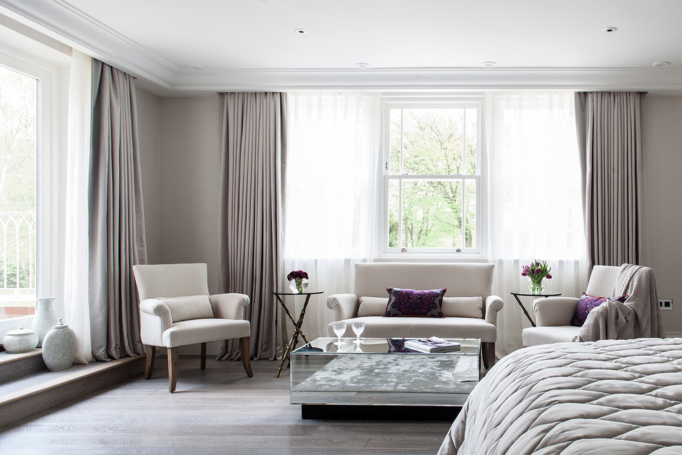 Transitional master dark wood floor bedroom photo in London with gray walls and no fireplace
