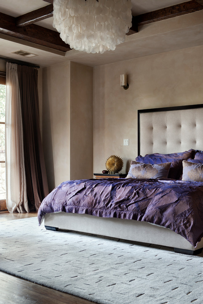 Photo of a mediterranean bedroom in Austin with beige walls.