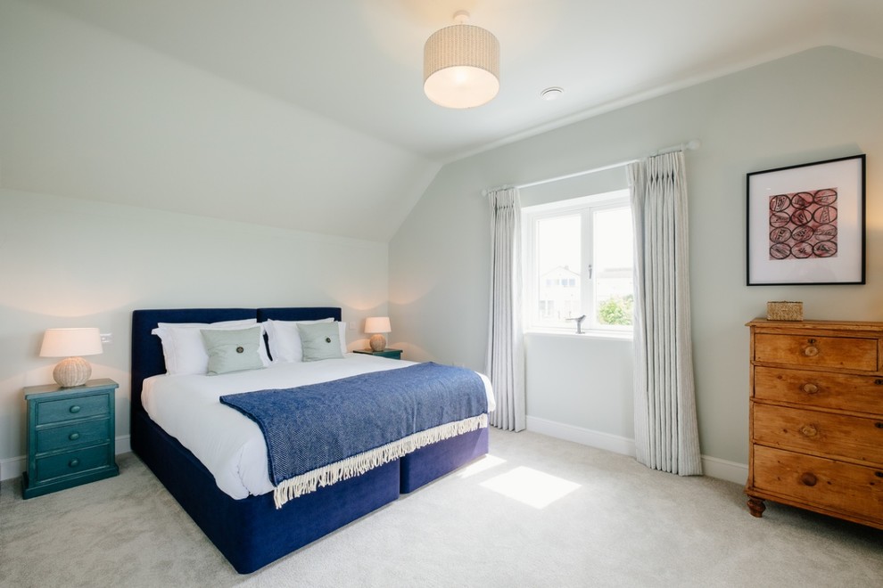 Inspiration for a medium sized beach style guest bedroom in Gloucestershire with blue walls, carpet and grey floors.