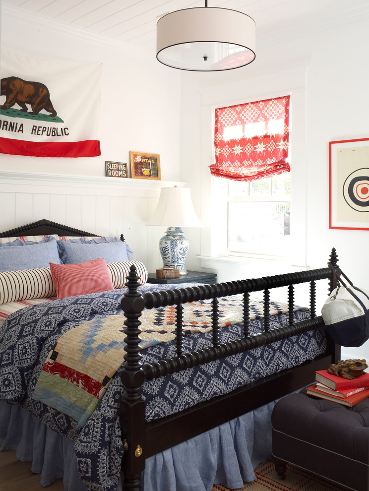 Inspiration for a mid-sized coastal guest light wood floor bedroom remodel in San Diego with white walls