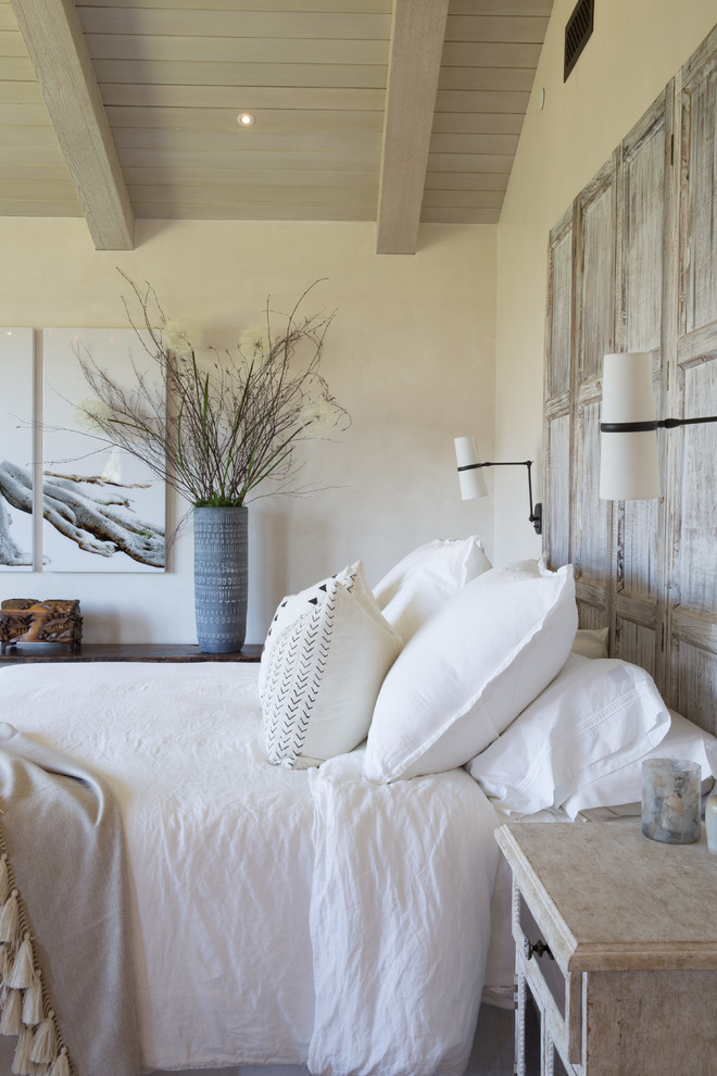 Inspiration for a mediterranean master light wood floor and beige floor bedroom remodel in Santa Barbara with white walls and no fireplace