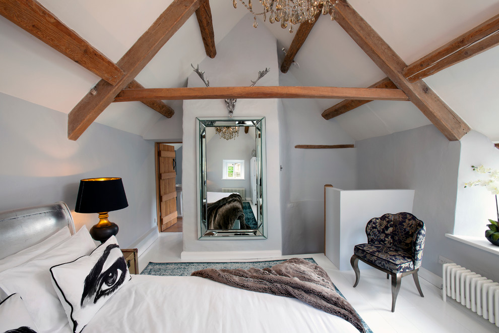 Inspiration for a mid-sized eclectic guest painted wood floor bedroom remodel in Gloucestershire with blue walls