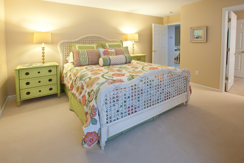 Example of a large beach style guest carpeted and beige floor bedroom design in Other with beige walls and no fireplace