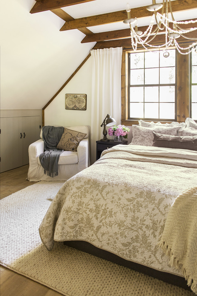 Mid-sized mountain style master laminate floor and brown floor bedroom photo in Tampa with white walls