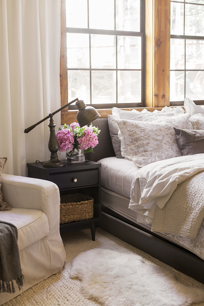 Bedroom - mid-sized rustic master laminate floor and brown floor bedroom idea in Tampa with white walls