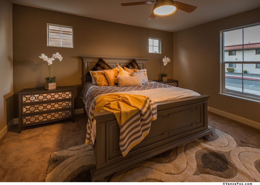 This is an example of a small traditional master bedroom in Other with beige walls, carpet and no fireplace.