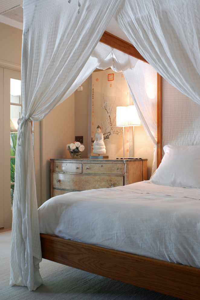 Eclectic bedroom photo in New York with beige walls