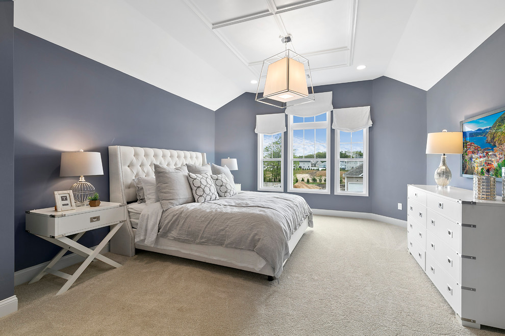 Example of a large trendy master carpeted and beige floor bedroom design in New York with gray walls and no fireplace