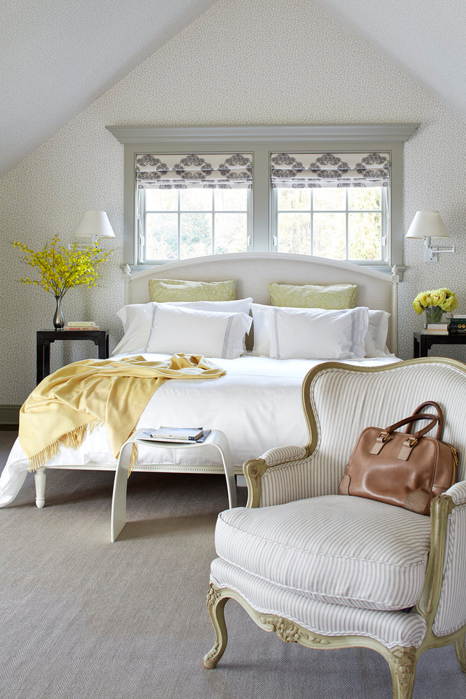 Design ideas for a traditional master bedroom in New York with beige walls and carpet.