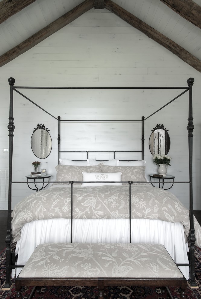 Example of a mid-sized farmhouse master dark wood floor bedroom design in Austin with white walls
