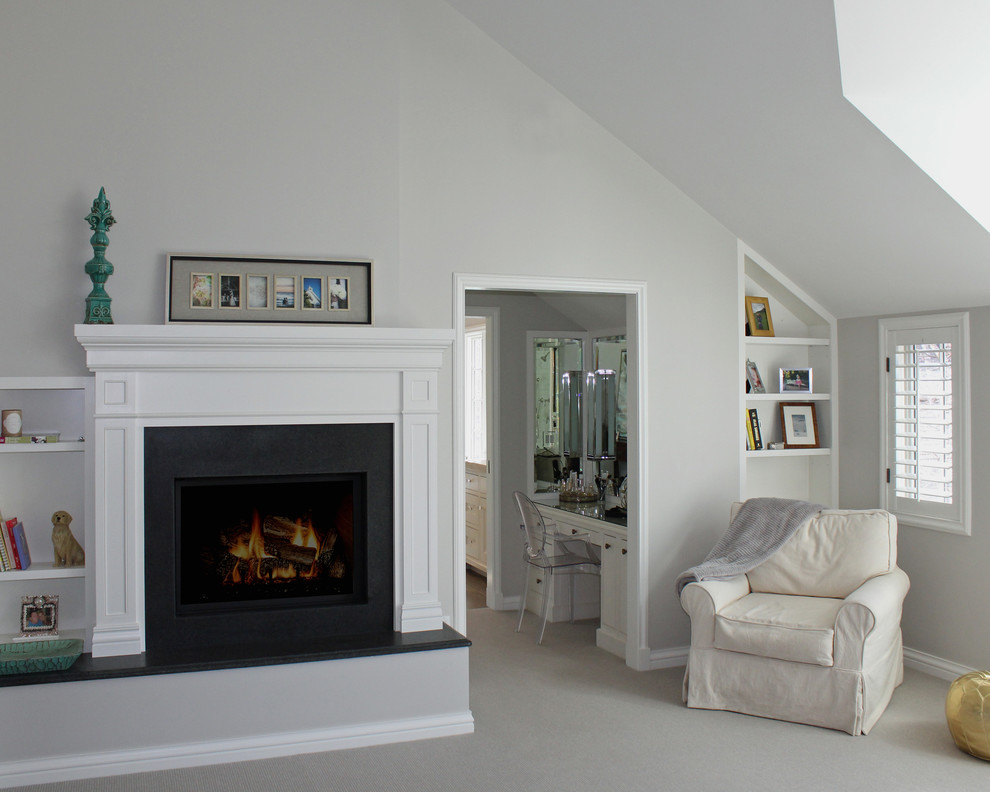 Photo of a large classic master and grey and cream bedroom in Denver with grey walls, carpet, a standard fireplace and a stone fireplace surround.
