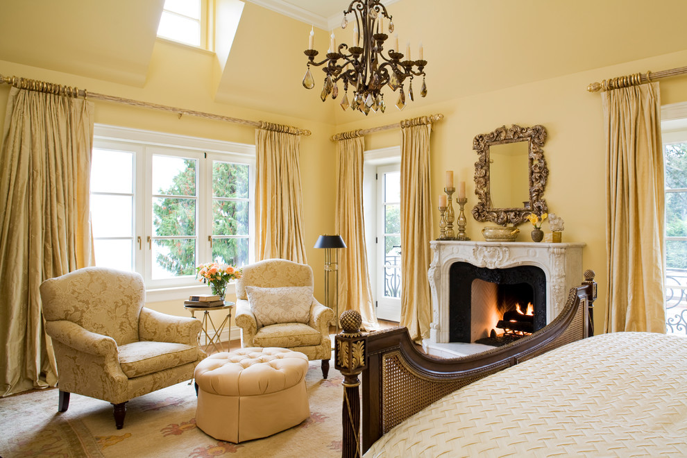 This is an example of a traditional bedroom in Seattle with yellow walls.