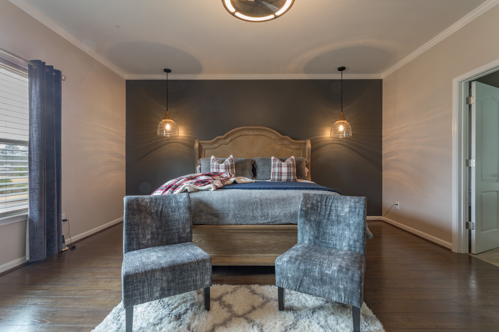 Example of a mid-sized eclectic master laminate floor and brown floor bedroom design in Atlanta with gray walls, a standard fireplace and a metal fireplace
