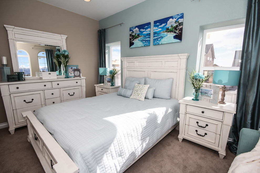 This is an example of a medium sized nautical guest bedroom in Denver with blue walls and carpet.