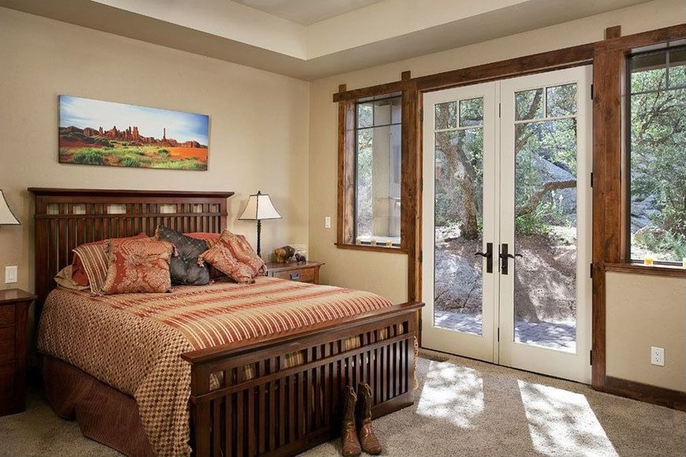 Inspiration for a large classic master bedroom in Phoenix with beige walls, carpet and beige floors.