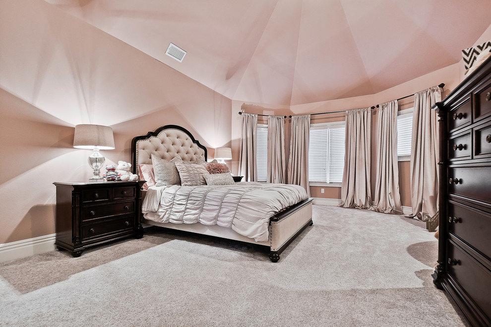Bedroom - large traditional guest carpeted and beige floor bedroom idea in Other with pink walls