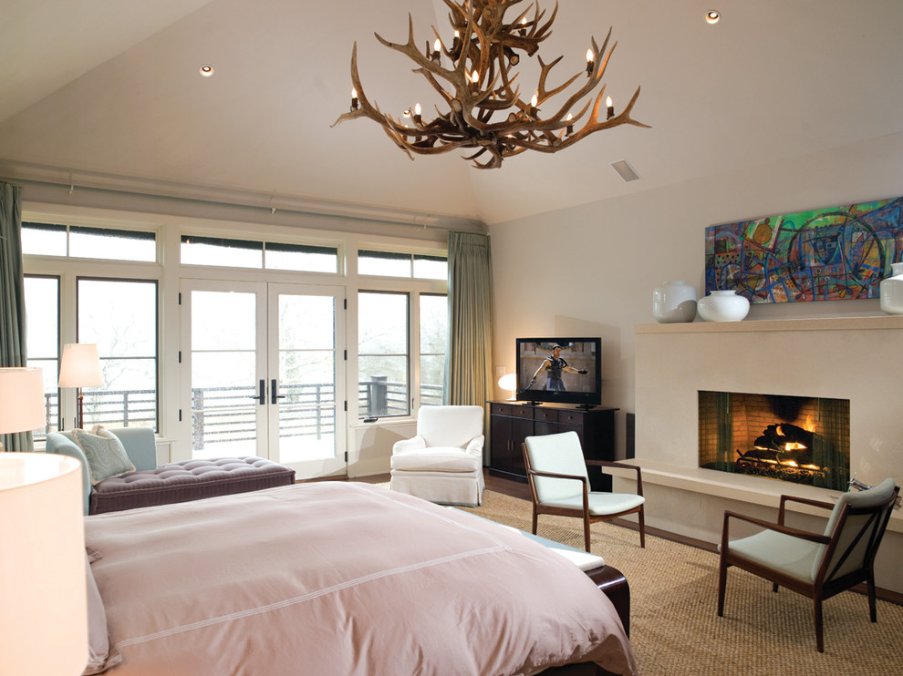 Inspiration for a contemporary bedroom in New York with a standard fireplace.