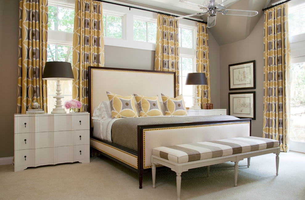 Example of a large transitional master carpeted bedroom design in Little Rock with gray walls and no fireplace