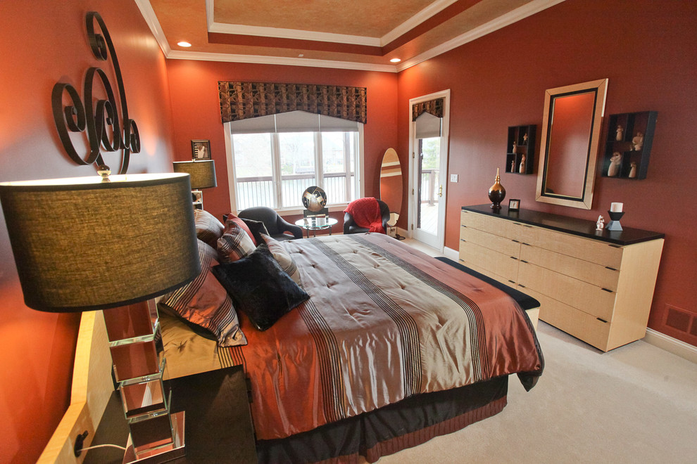 Design ideas for a large contemporary master bedroom in Louisville with red walls and carpet.