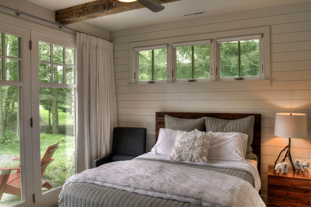 Modelo de dormitorio rural con paredes blancas