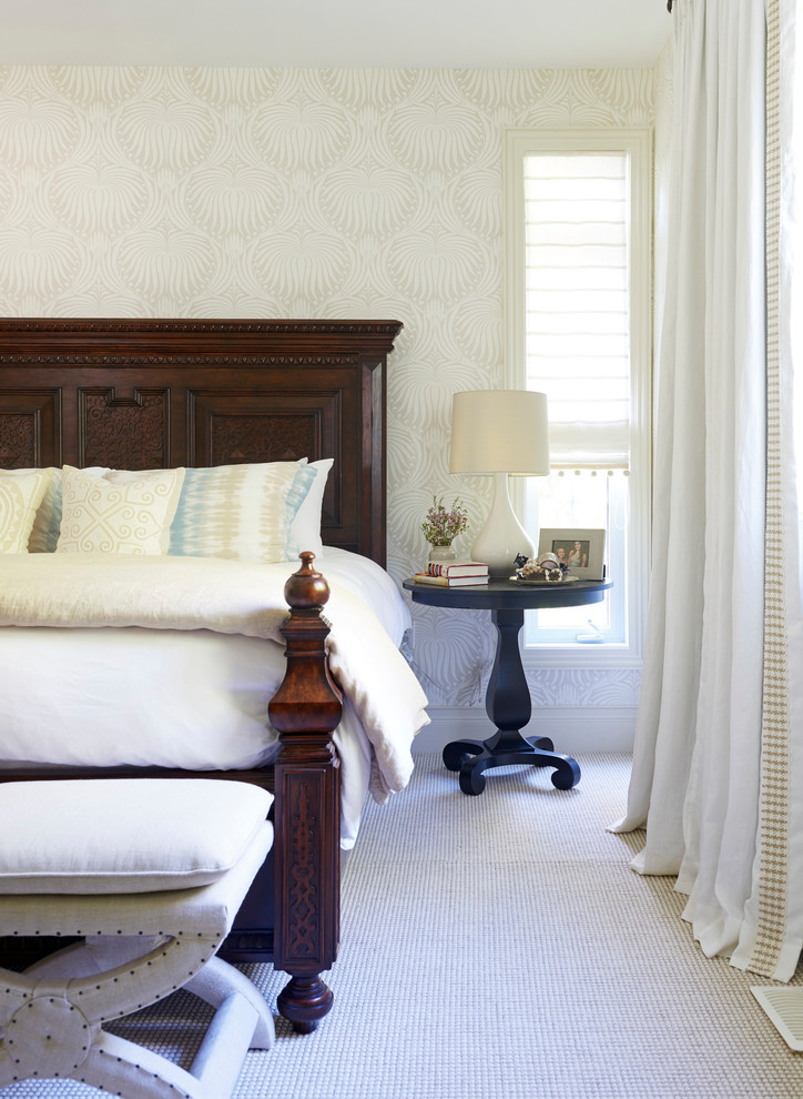 This is an example of a medium sized beach style master bedroom in Toronto with carpet.