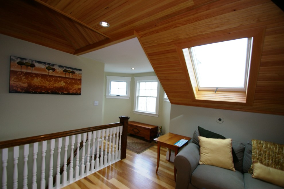 Large traditional guest bedroom in Boston with grey walls, medium hardwood flooring, no fireplace and brown floors.