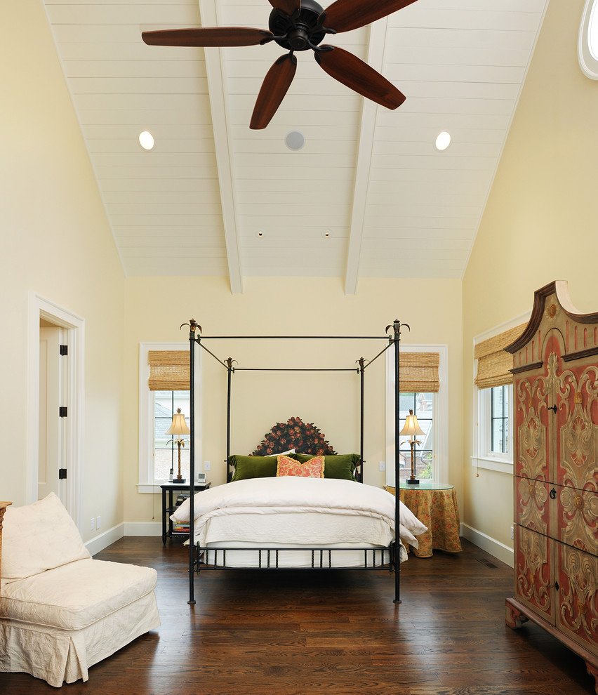 Design ideas for a traditional bedroom in Nashville with beige walls and dark hardwood flooring.