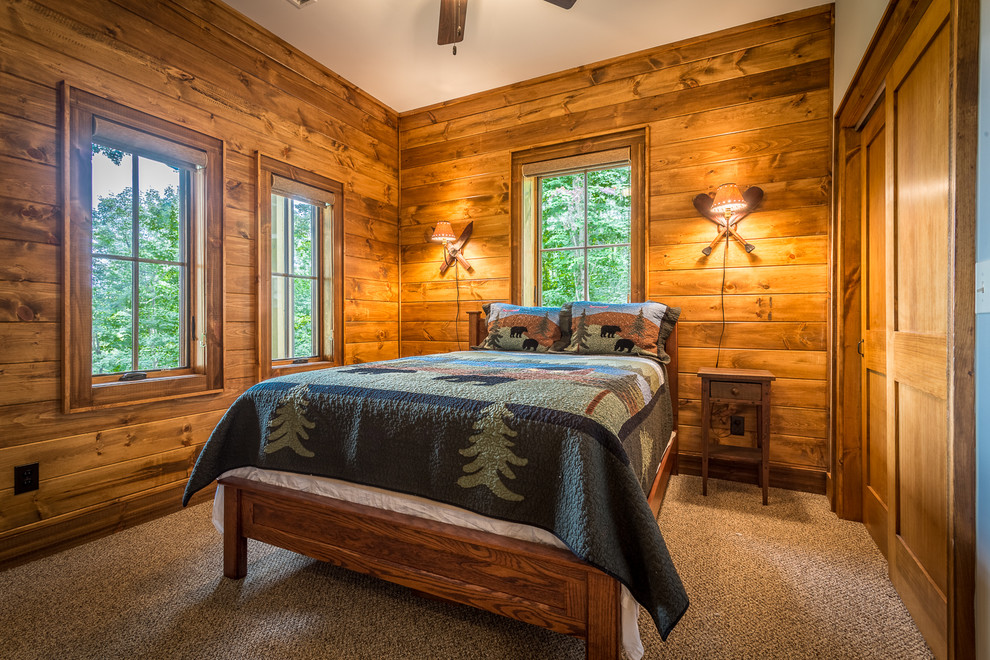 Bedroom - mid-sized rustic guest carpeted and beige floor bedroom idea in Charlotte with brown walls