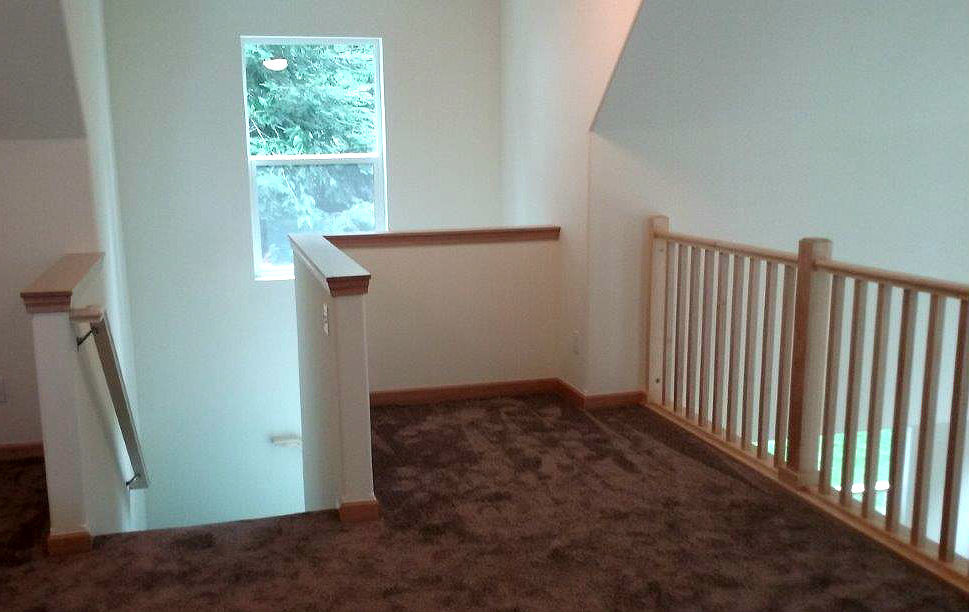 Inspiration for a mid-sized craftsman loft-style carpeted bedroom remodel in Seattle with white walls
