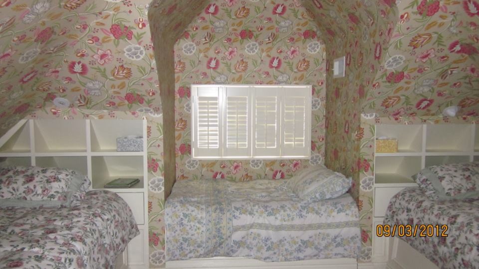 Example of an island style bedroom design in New York
