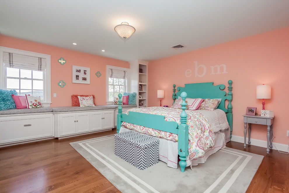 Design ideas for a large shabby-chic style guest bedroom in Boston with pink walls and medium hardwood flooring.