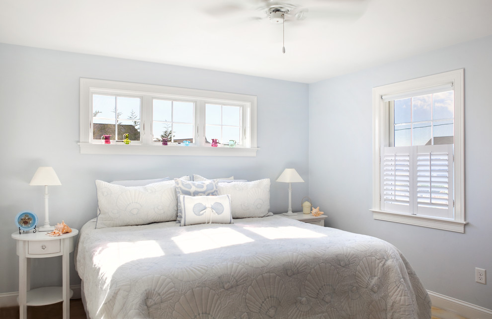 Beach style bedroom photo in Boston with blue walls