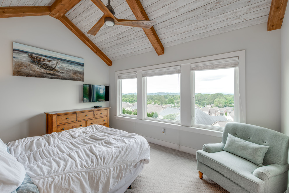 This is an example of a medium sized beach style master bedroom in Other with grey walls, carpet and grey floors.