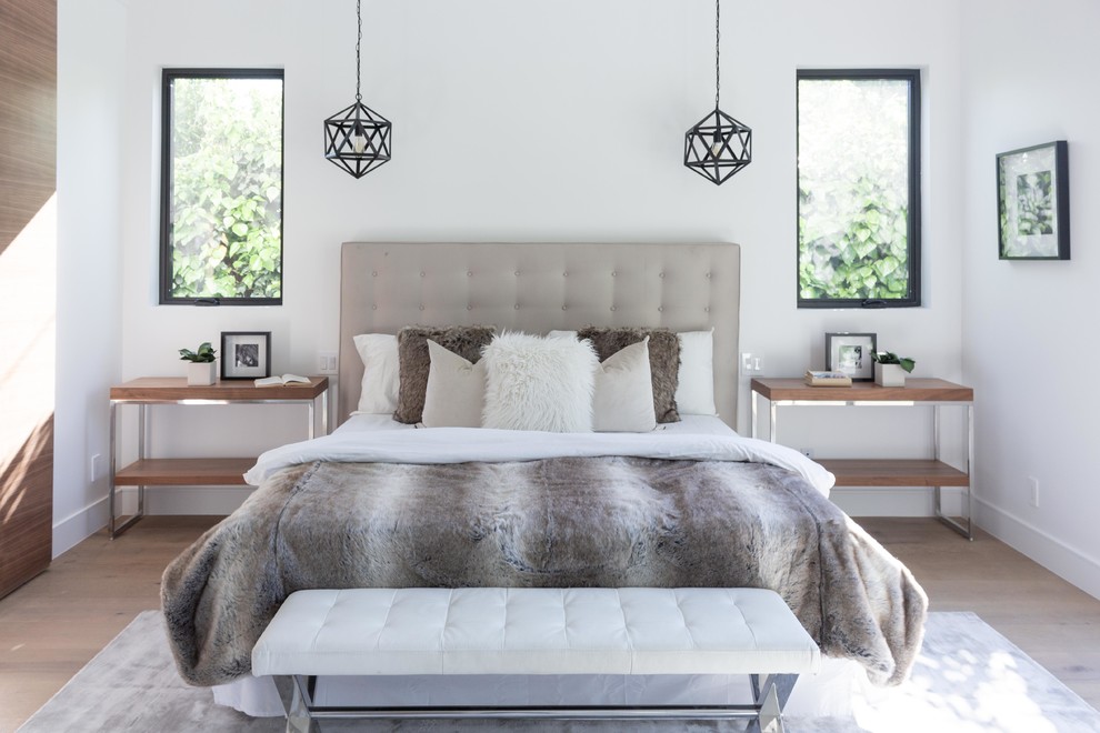 Inspiration for a medium sized classic guest bedroom in Los Angeles with white walls, laminate floors and beige floors.