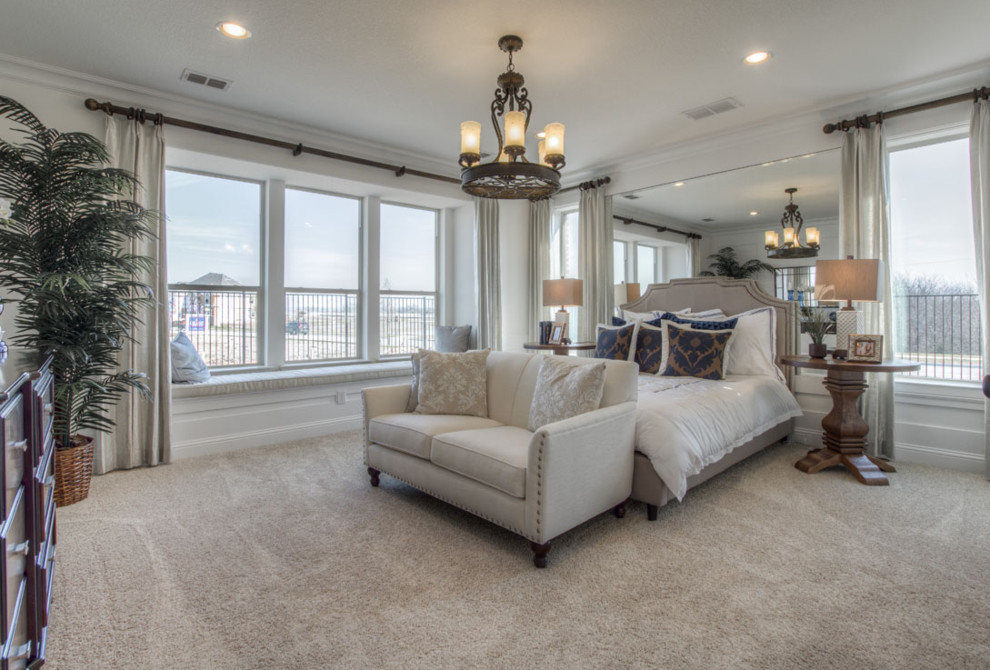 This is an example of a large classic master bedroom in San Diego with grey walls, carpet and brown floors.