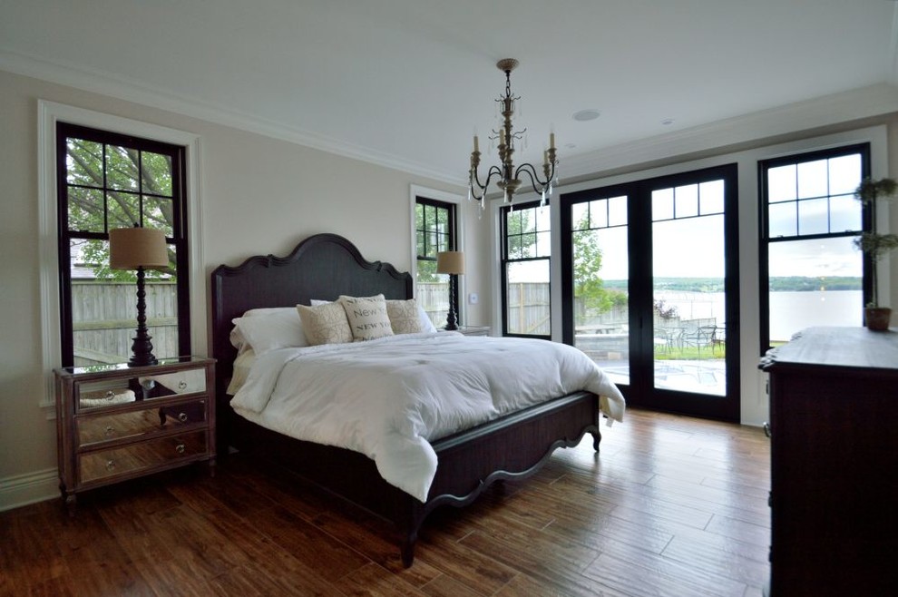 Master porcelain tile bedroom photo in New York with no fireplace
