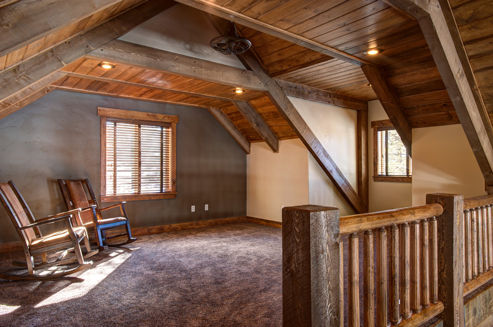 Large rustic mezzanine bedroom in Salt Lake City with beige walls and carpet.