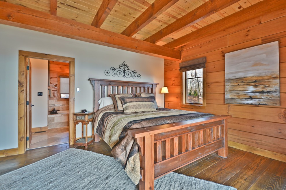 Inspiration for a mid-sized craftsman master medium tone wood floor and brown floor bedroom remodel in Other with beige walls and no fireplace