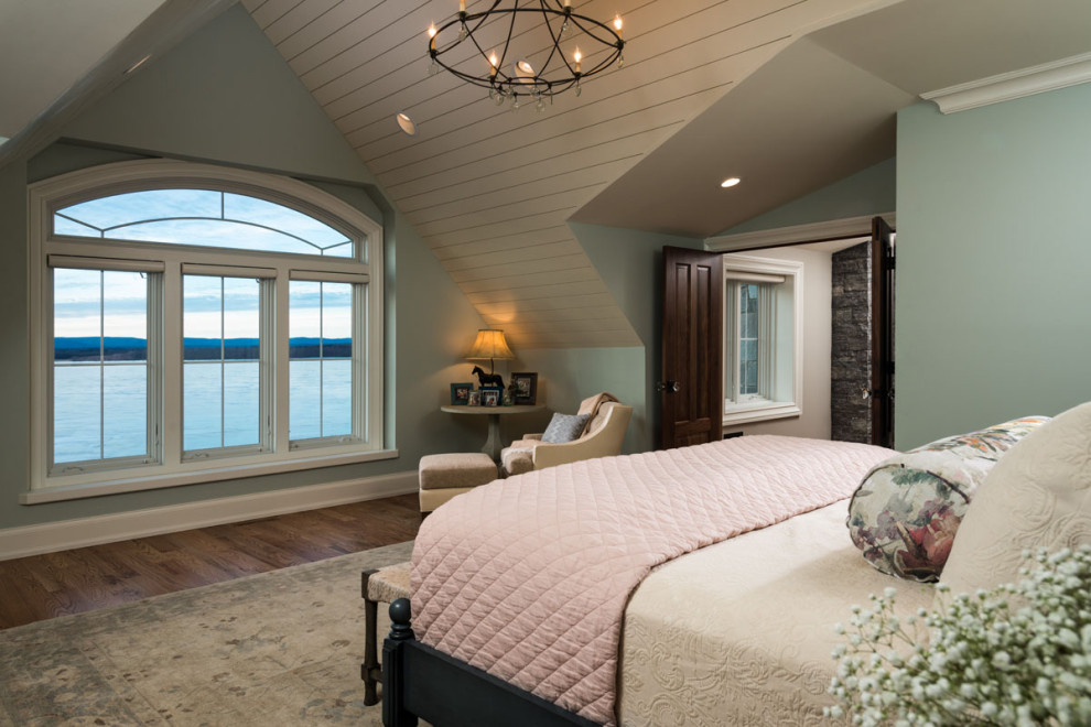 Rustic master bedroom in Other with green walls, medium hardwood flooring, no fireplace, a vaulted ceiling and tongue and groove walls.